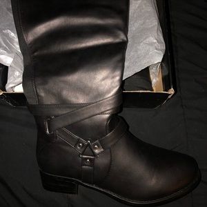 Torrid knee high boots.